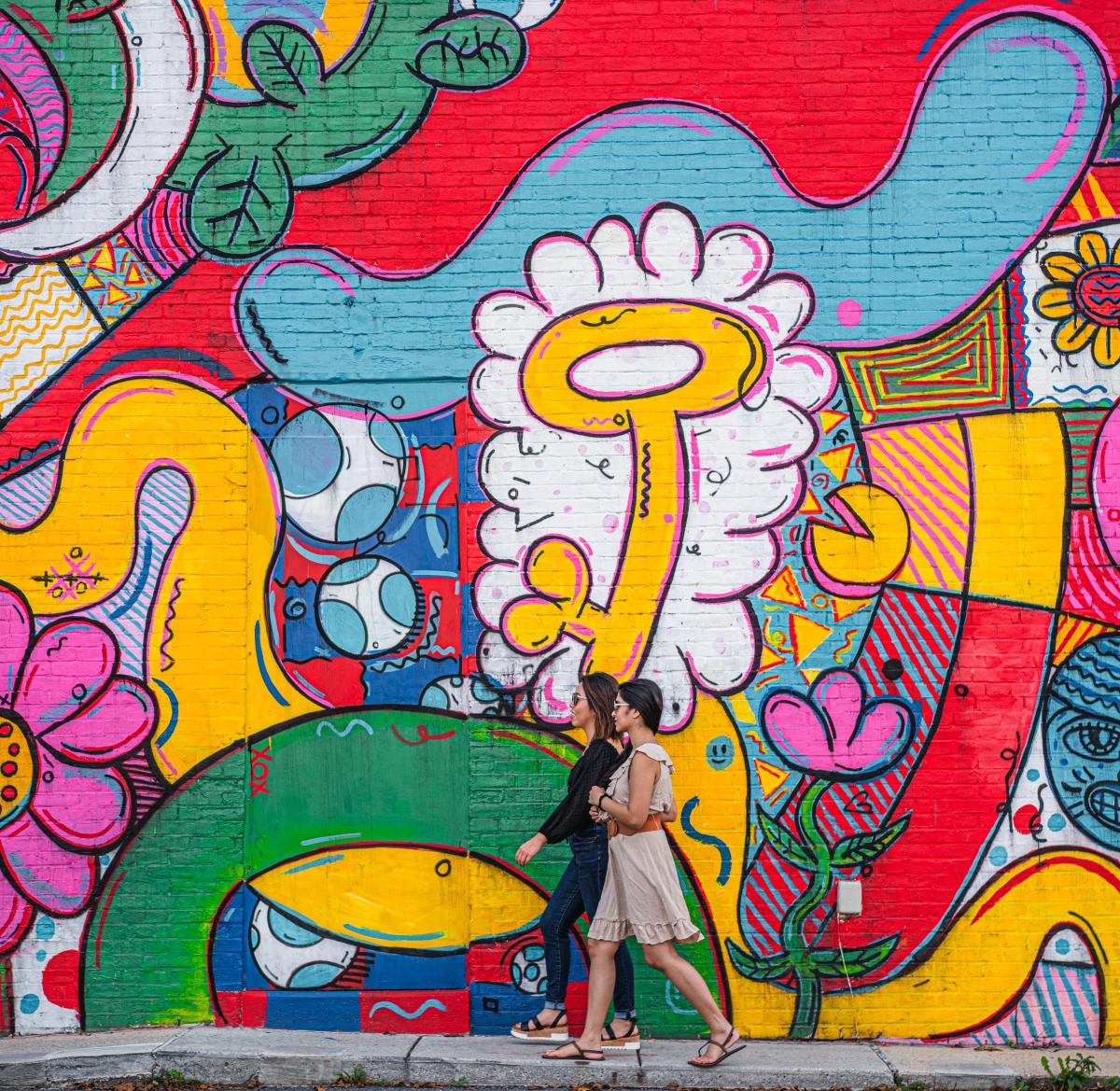 Ladies walking beside Mural in New Cumberland