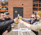 Group of guys drinking beers at the Brewing Projekt