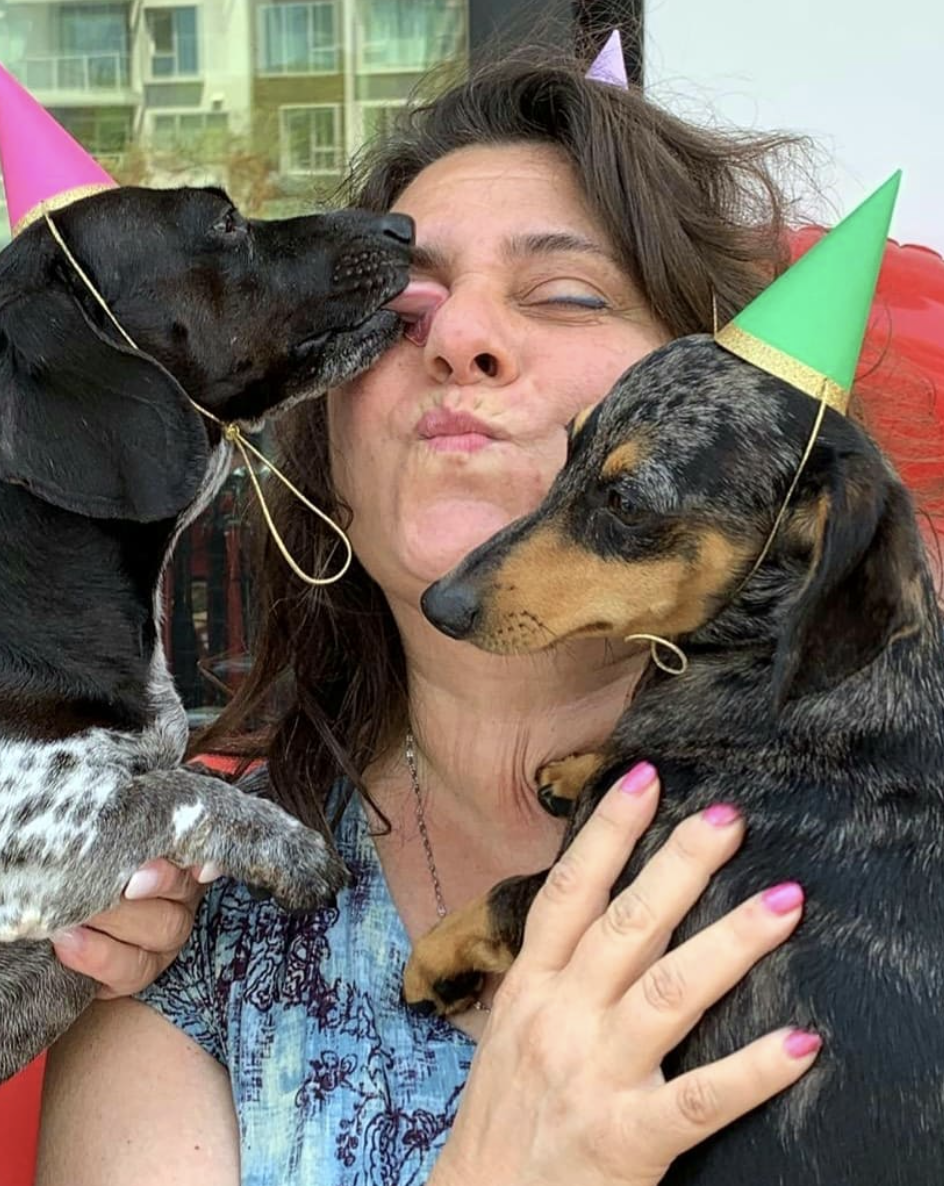 Top Dog Barkery in Pacific City with Owner kissing a dog