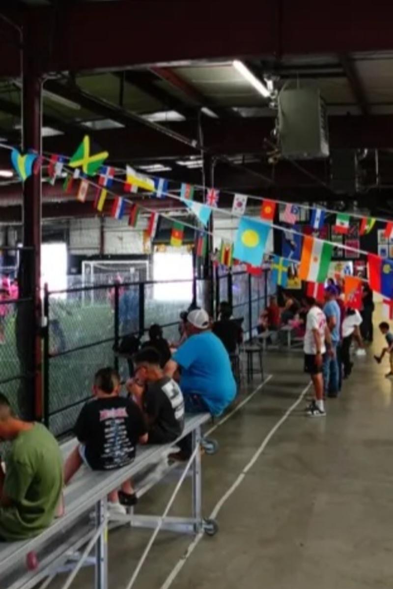 Fans watch a soccer game at The Shop NM.