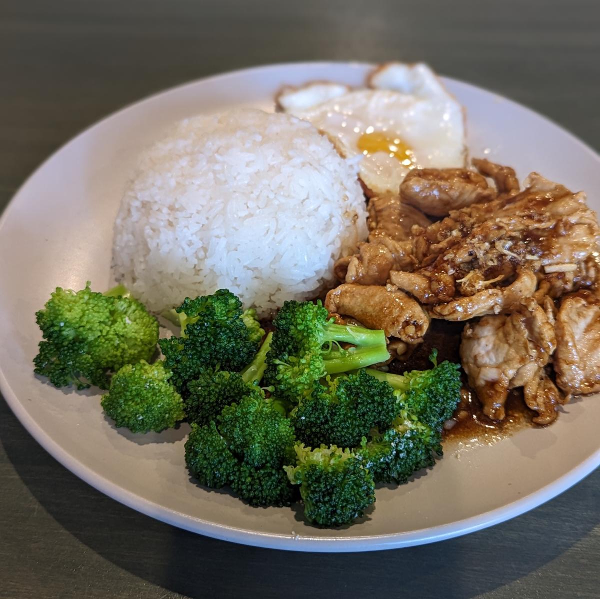 The image is of the Garden Pork at Thai Pavilion which features broccoli, rice, an egg and pork.