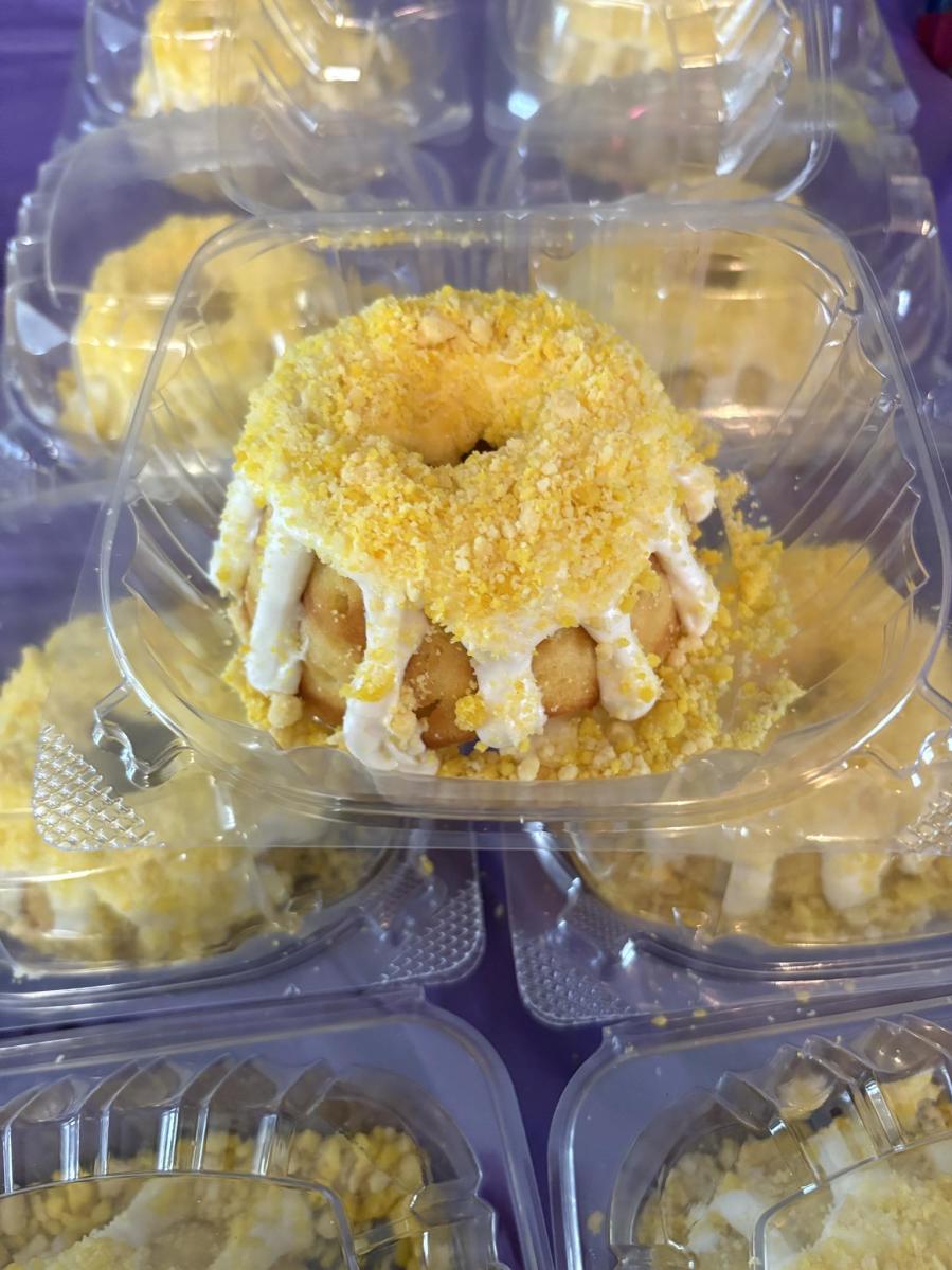 B & B Generations' donuts with heavy icing boxed in individual, clear plastic containers.