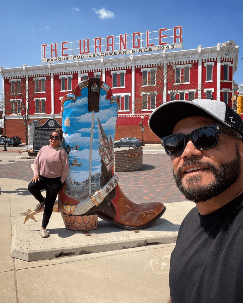 Selfie at the Cowboy Boot sculpture at The Wrangler, a best place to take a selfie in Cheyenne.