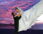 Groom and Bride Kissing at sunset 