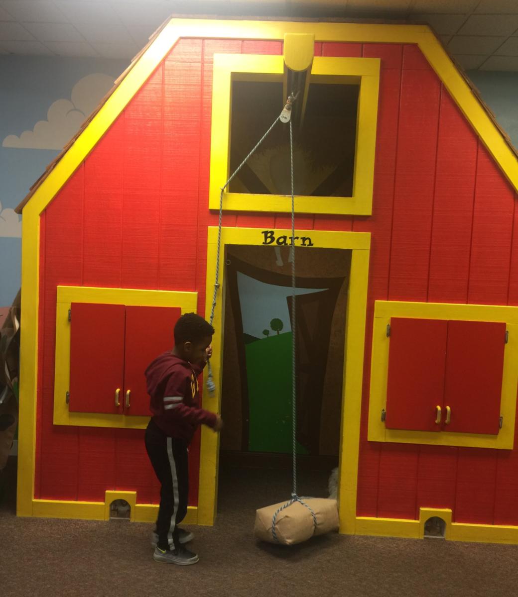 Kid playing at Barn