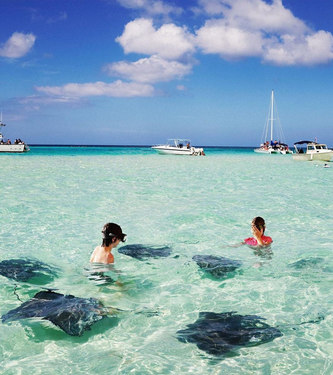Stingray City in the Cayman Islands, destination known for its shallow blue waters and friendly stingrays
