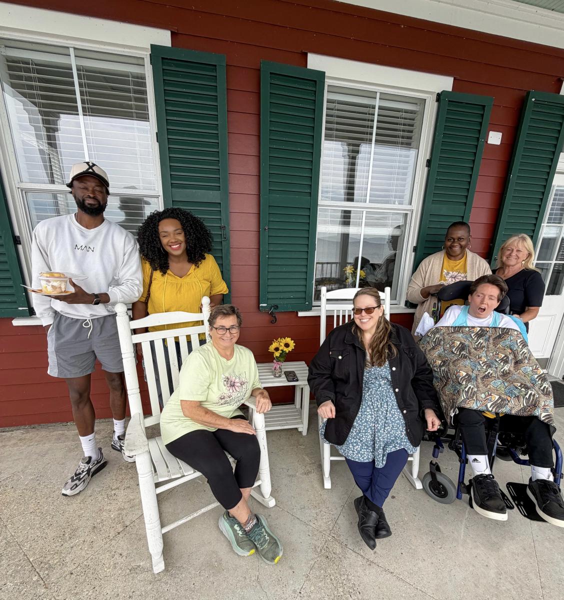 Christy and PJ Paulsell join Visit The Northshore staff on the porch of accessible Cabin 4 at Fontainebleau State Park during their overnight stay.