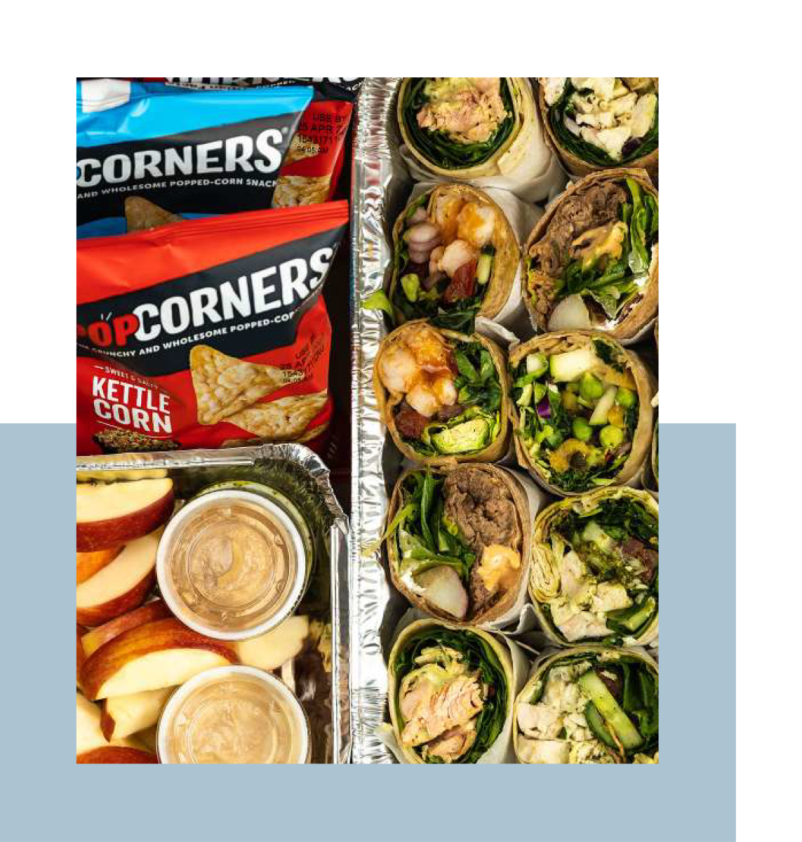Catering spread of wraps, apples and peanut butter, and PopCorners