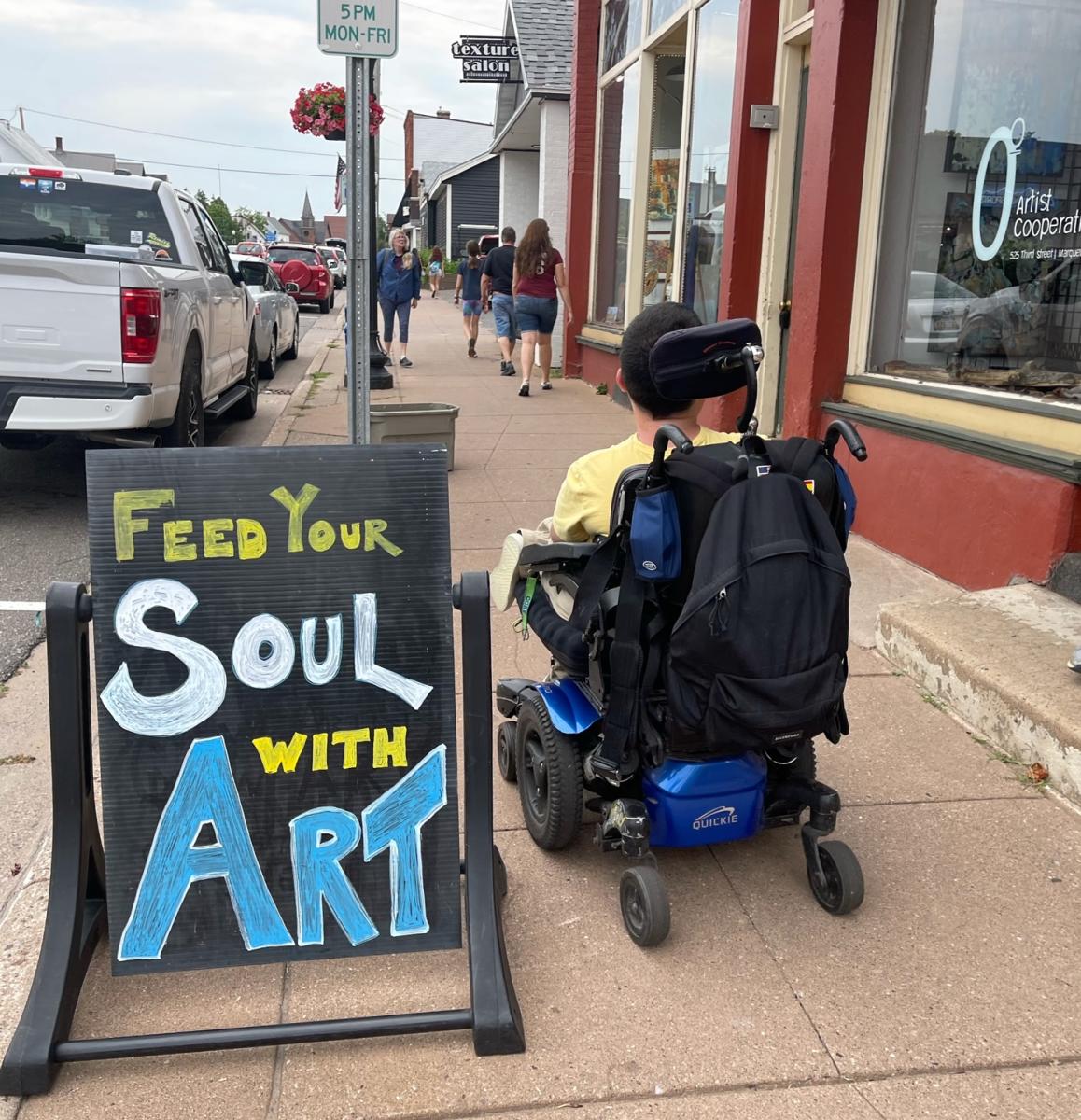 Feed Your Soul With Art sign outside local businesses