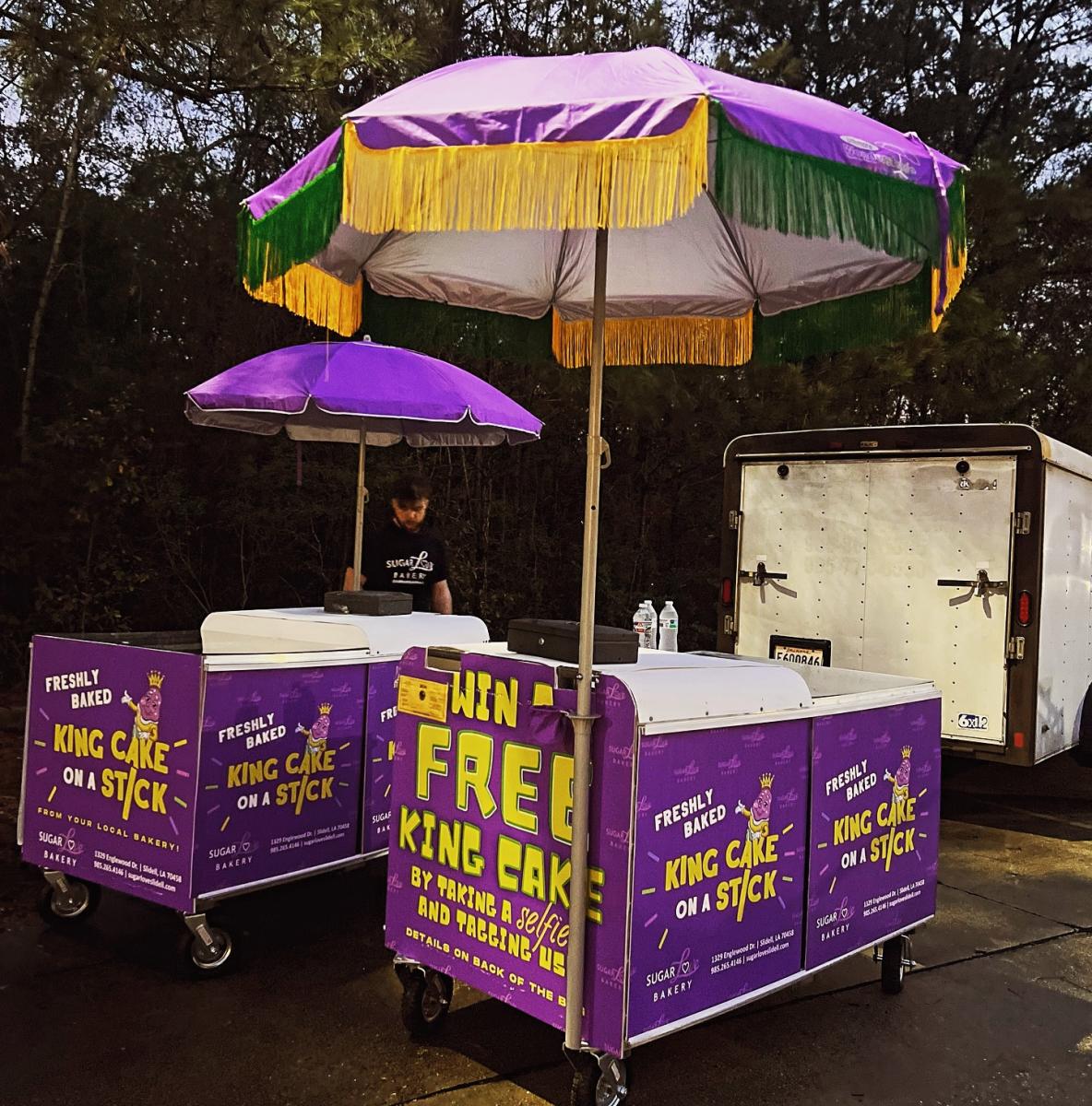 Sugar Love Bakery brings its King Cake on a Stick to the parade route with its mobile cart.