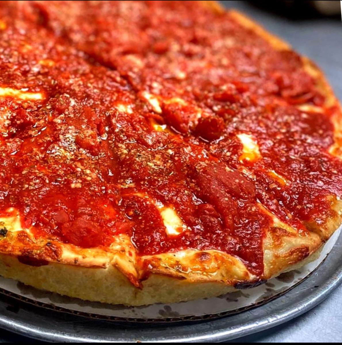 deep-dish pizza with a rich tomato sauce