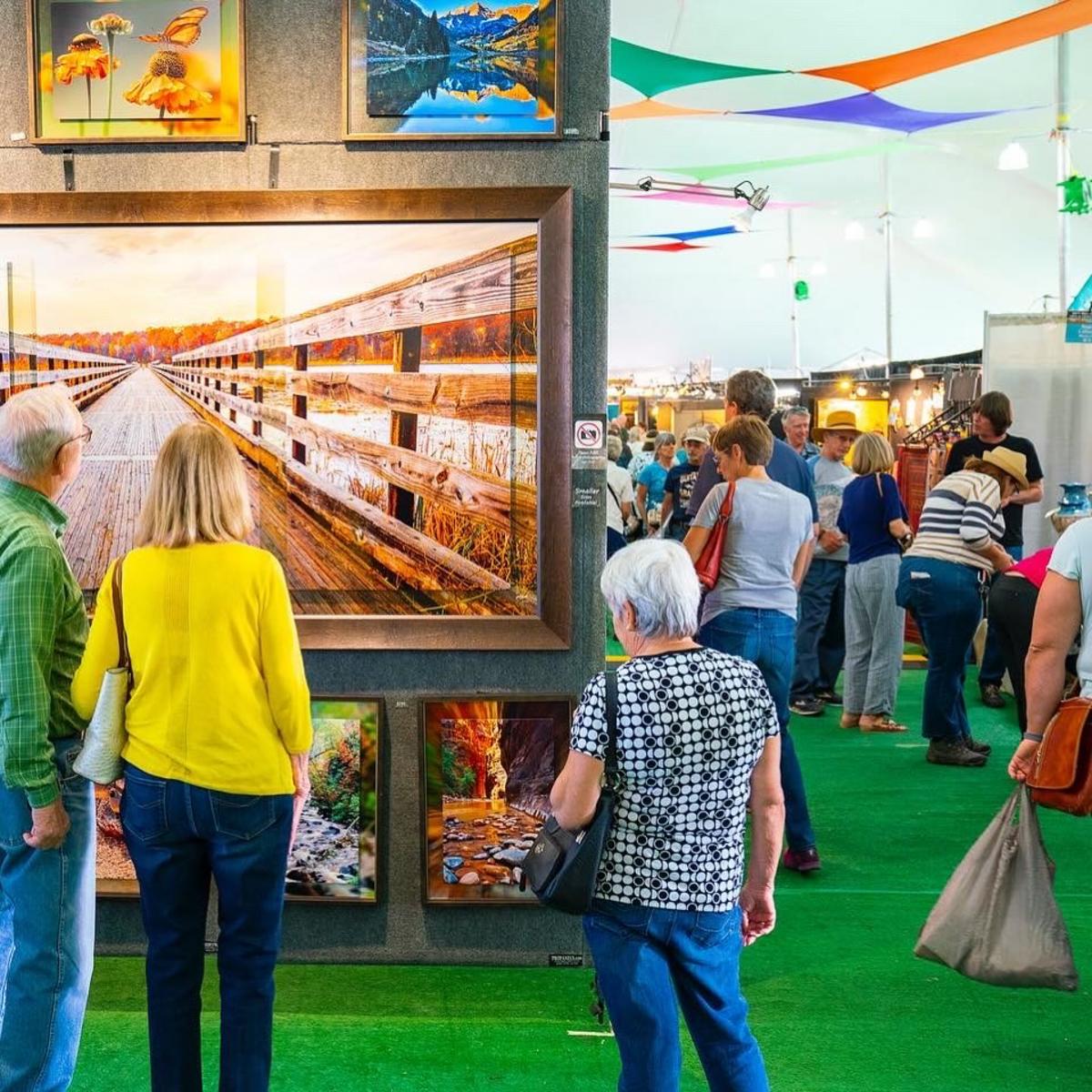 Attendees view art at the Rio Grande Arts & Crafts Festival.