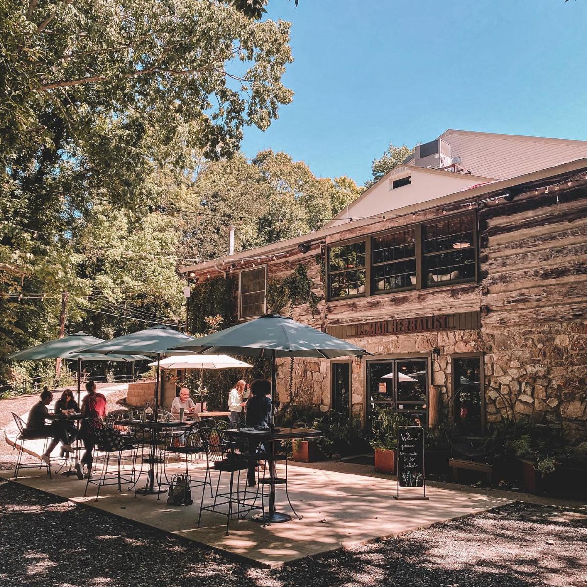 patio dining tables outside of a historic restaurant