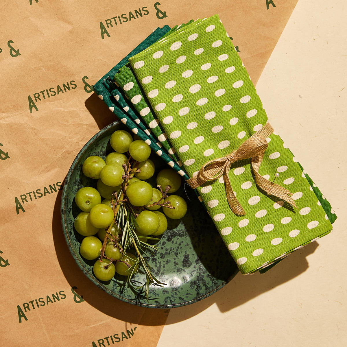 Green plate and tea towels from Artisans &