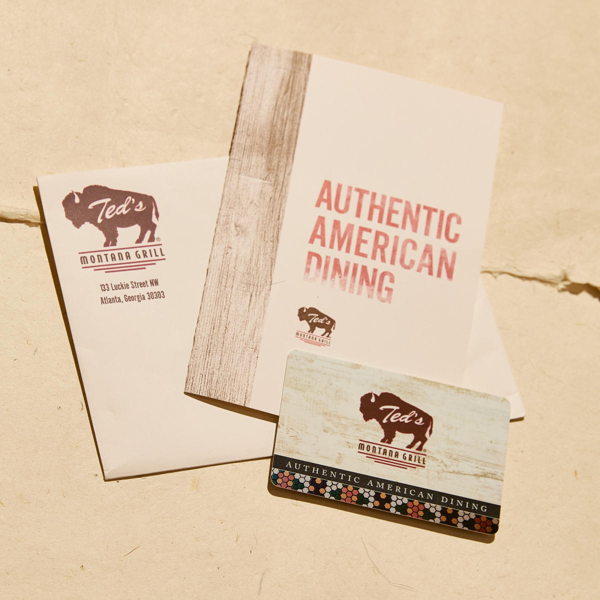Printed menu and gift card from Ted's Montana Grill