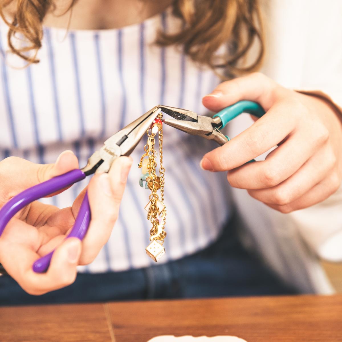 Woman making a charm bracelet