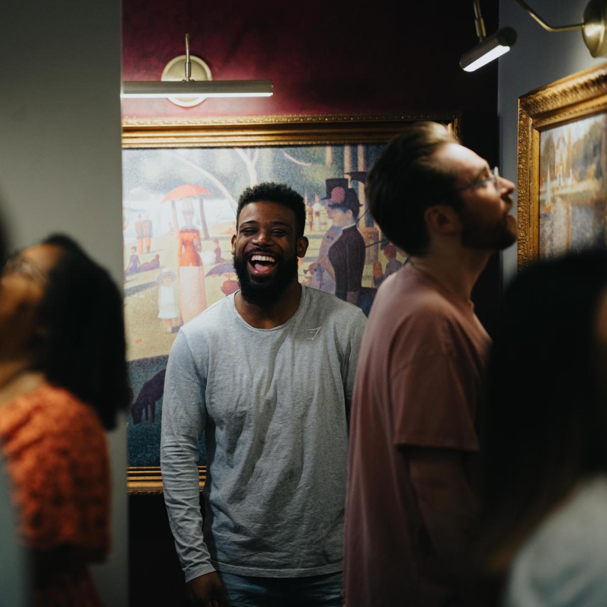 Group analyzing details and laughing in escape room