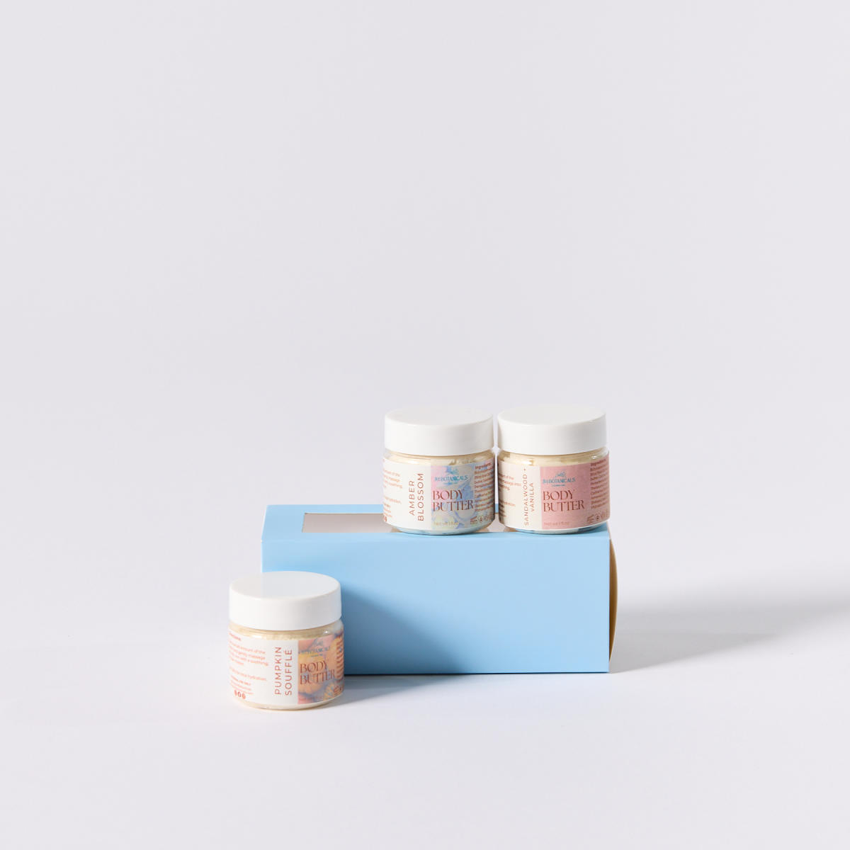 Pumpkin Souffle, Amber Blossom, and Sandalwood + Vanilla body butters from JM Botanicals