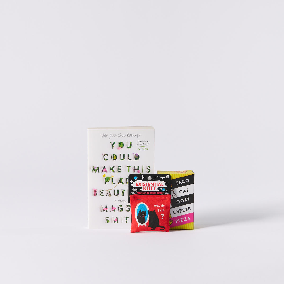 "You Could Make This Place Beautiful" book, Taco Cat Goat Cheese Pizza game, and catnip from Wild Cat Gift and Party