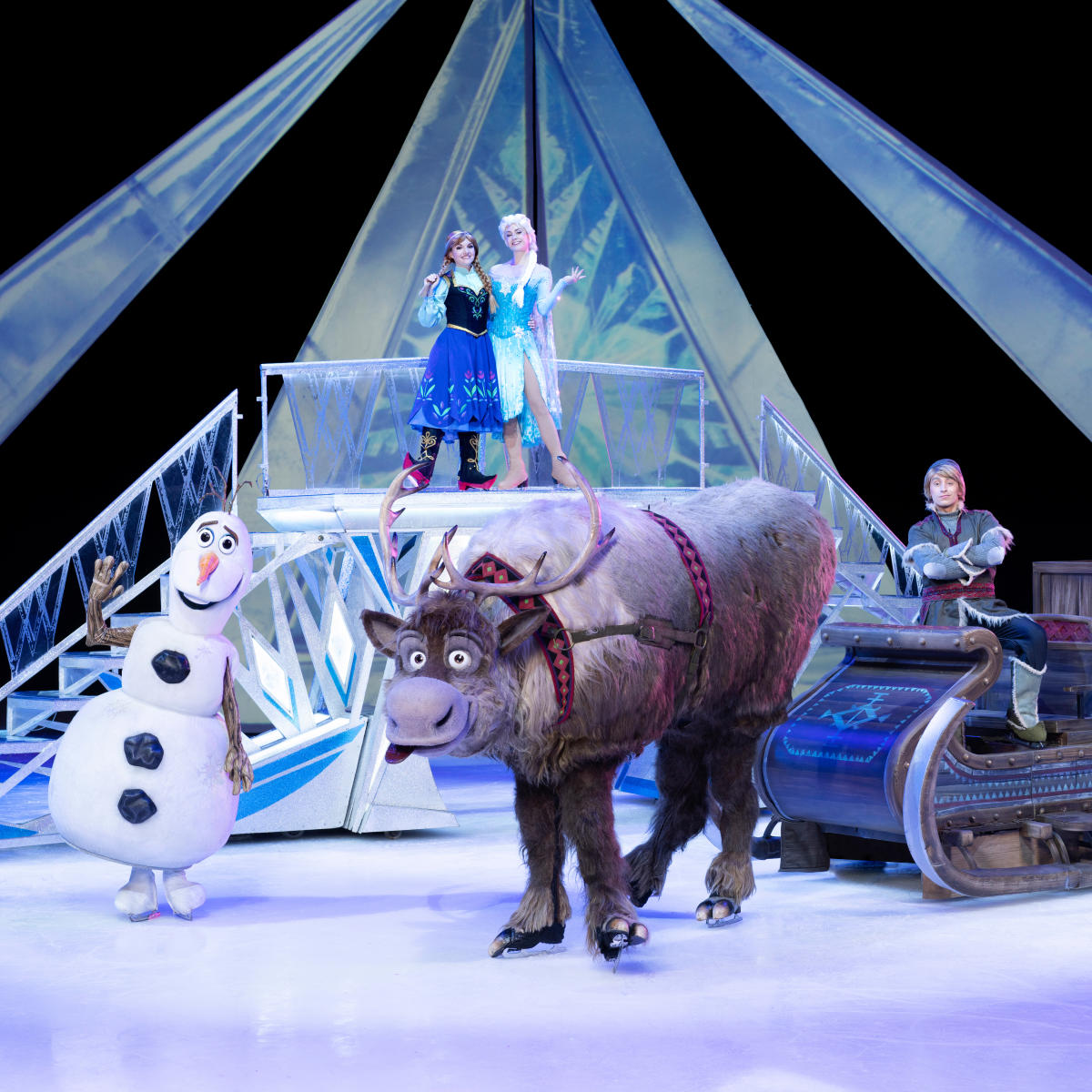 Disney on Ice performers on stage during a Frozen performance