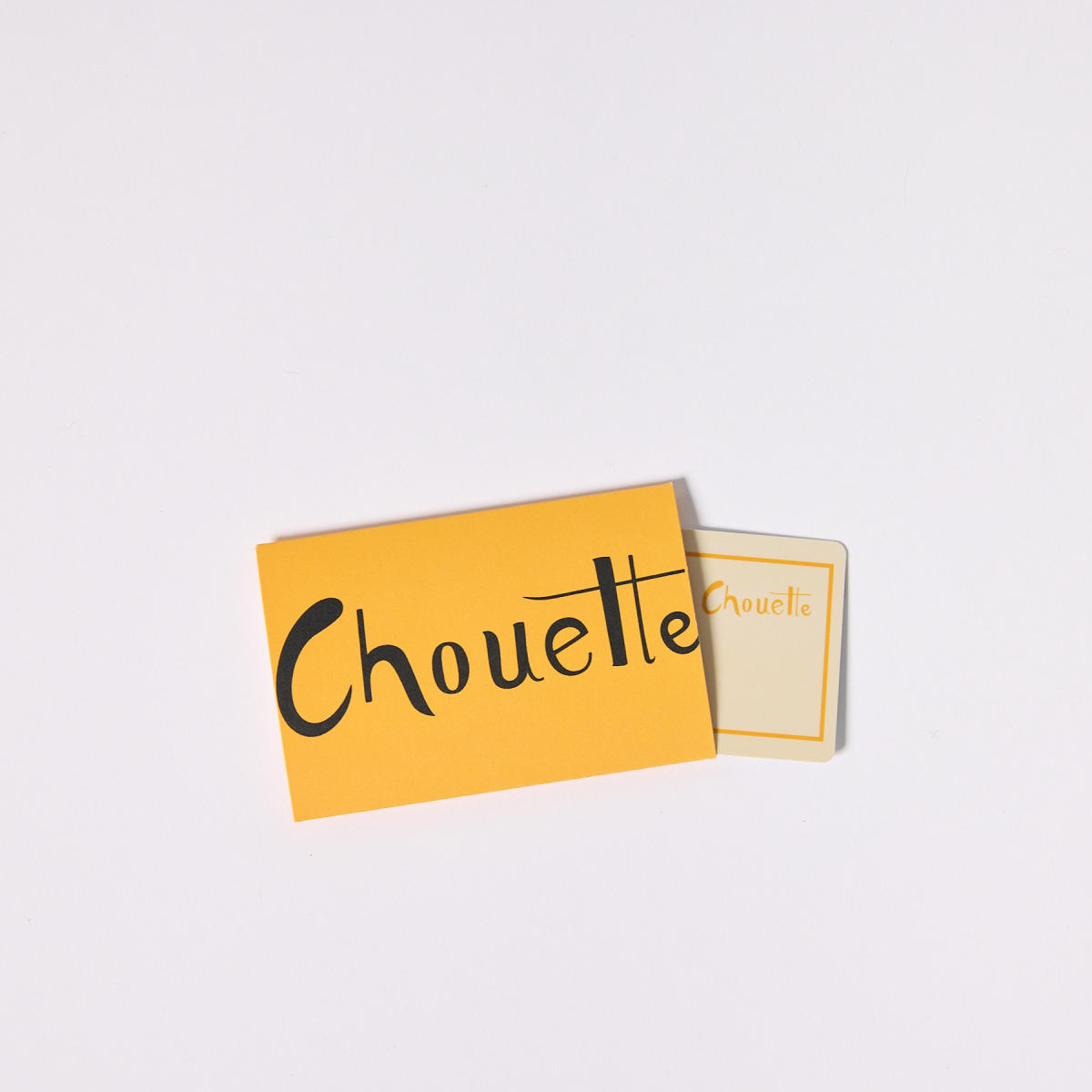 Yellow Chouette gift card on grey background