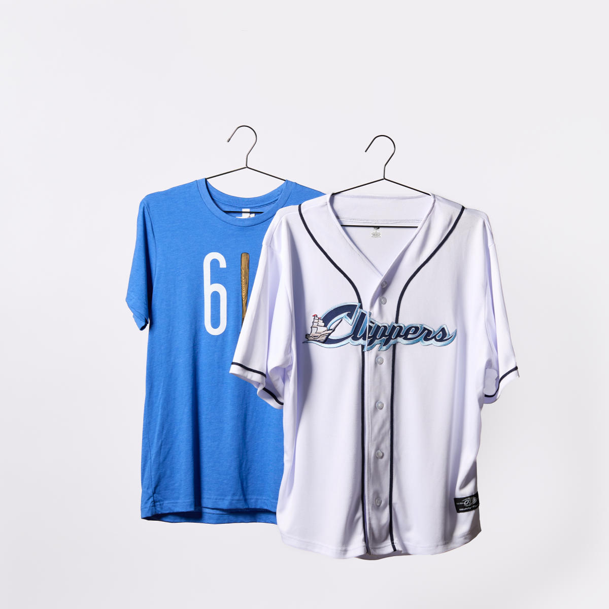 White Columbus Clippers jersey hanging on a hanger