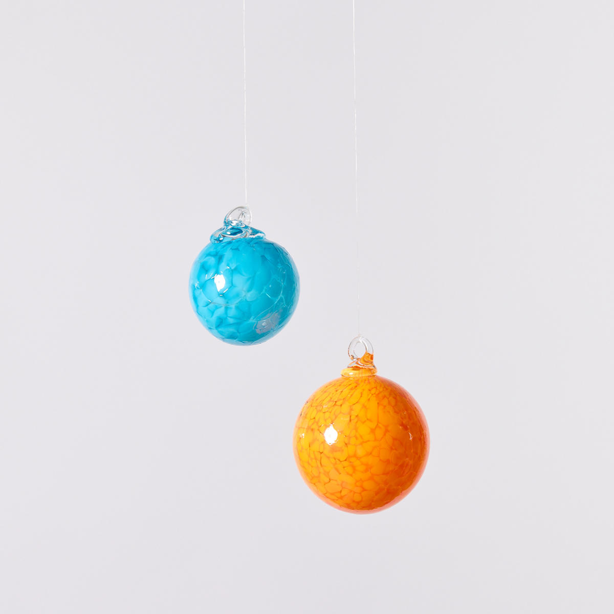 Sky blue and bright orange glass ornaments from Franklin Park Conservatory