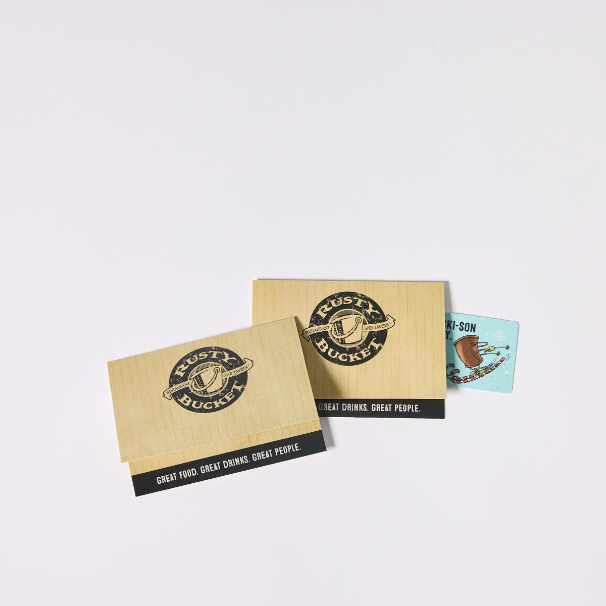 Gift card to Rusty Bucket peeking out of a tan Rusty Bucket envelope
