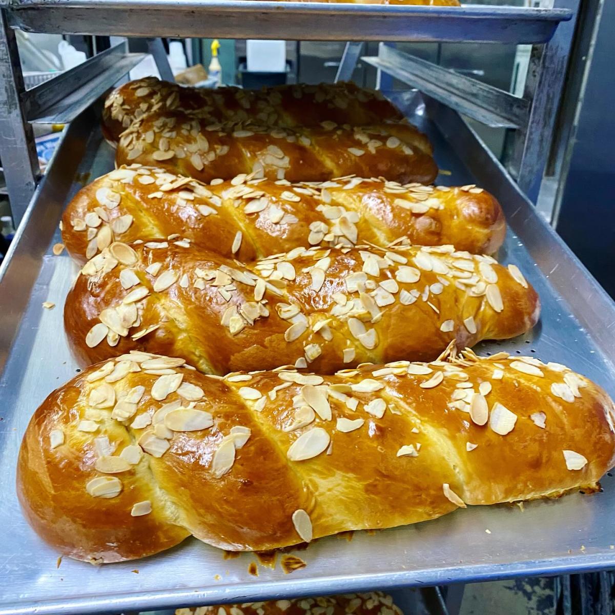 Greek Tsoureki loaves topped with almonds