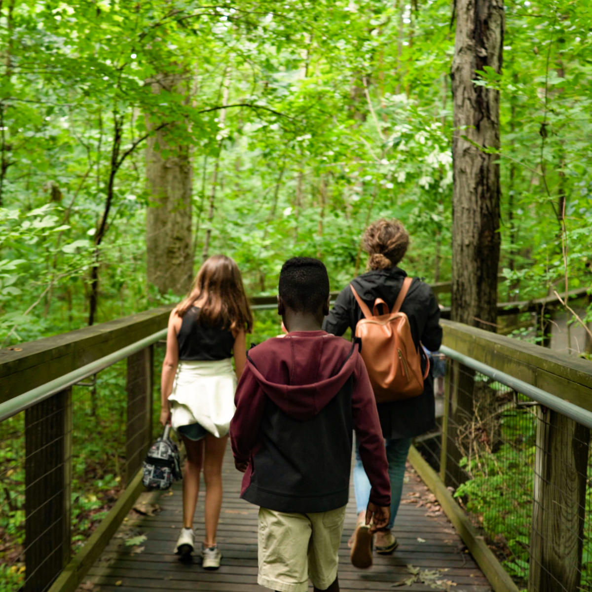 Family on trail through the Lindenwood Nature Preserve