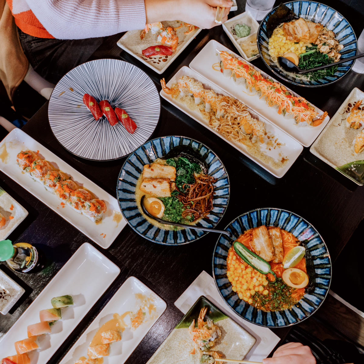 Overhead view of a feast of sushi and other Japanese food at Haru Sushi Izakaya in Fort Wayne, Indiana.