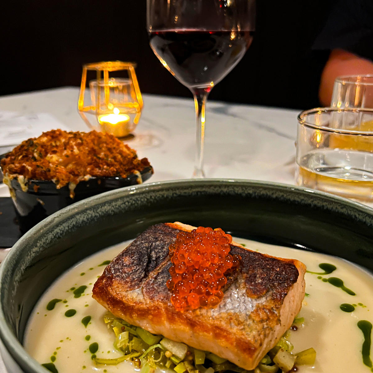 A dinner at Dana's in Fort Wayne. Salmon, baked mac and cheese, and red wine.