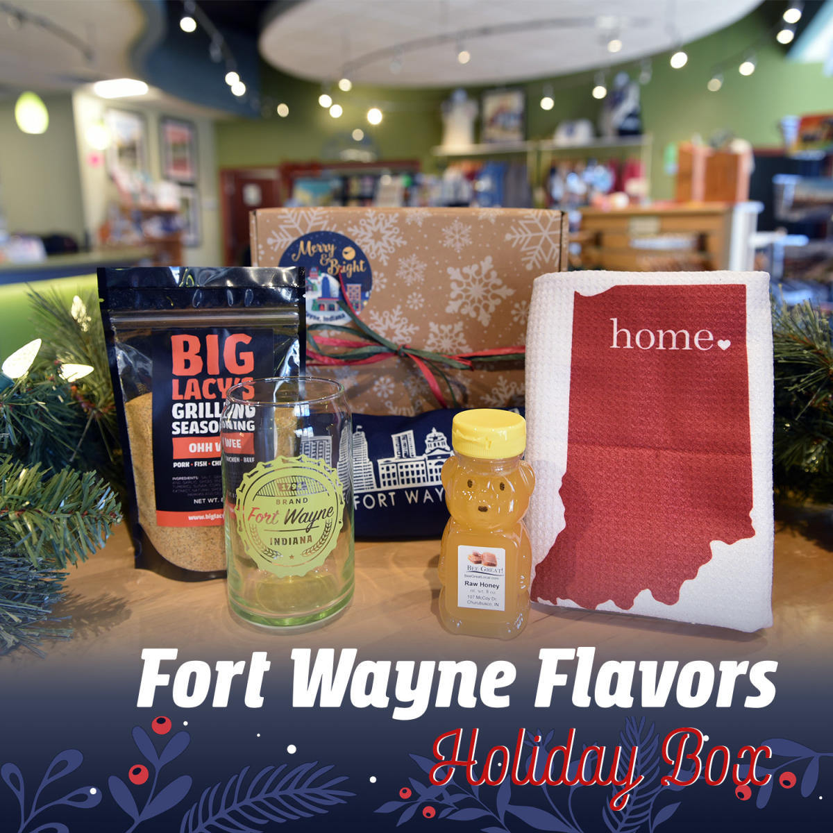 Gift box showing grilling seasoning, local honey, Fort Wayne apron, Indiana state tea towel, and Fort Wayne glass can cup.
