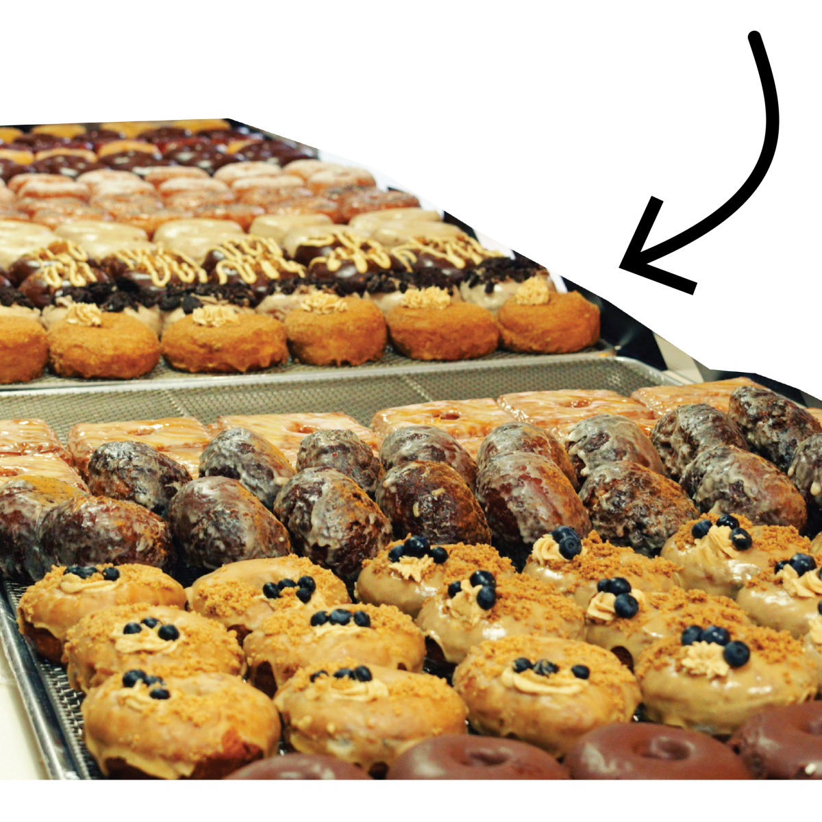 An arrow points to rows of doughnuts