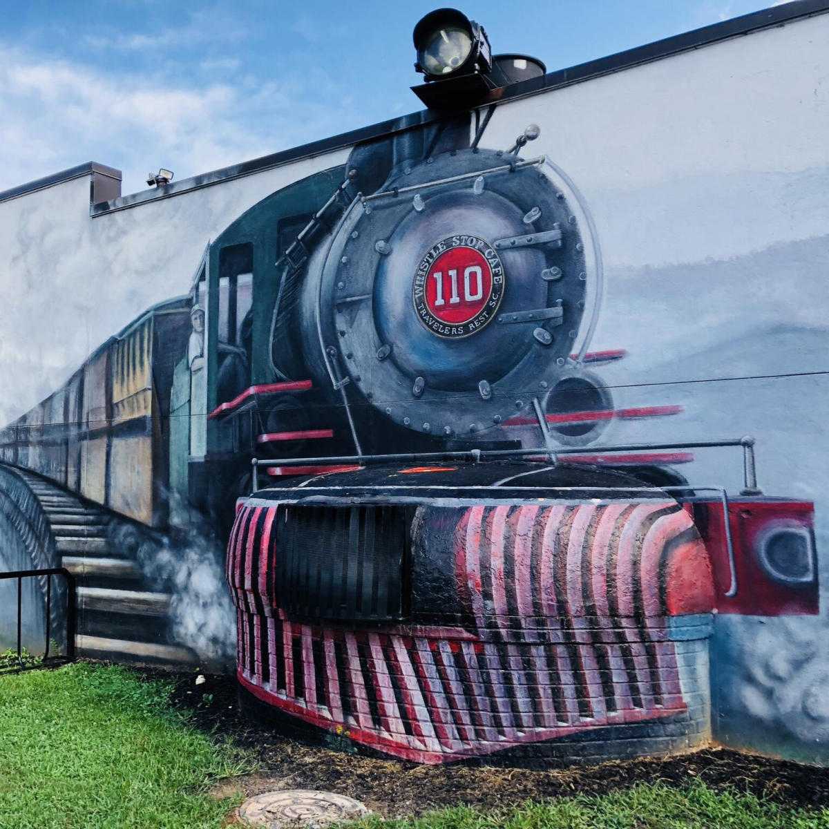 A train mural at the Whistle Stop at the American Café in downtown Travelers Rest, SC.