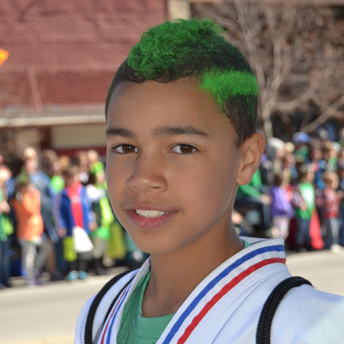 St. Patrick’s Day Parade boy with green hair