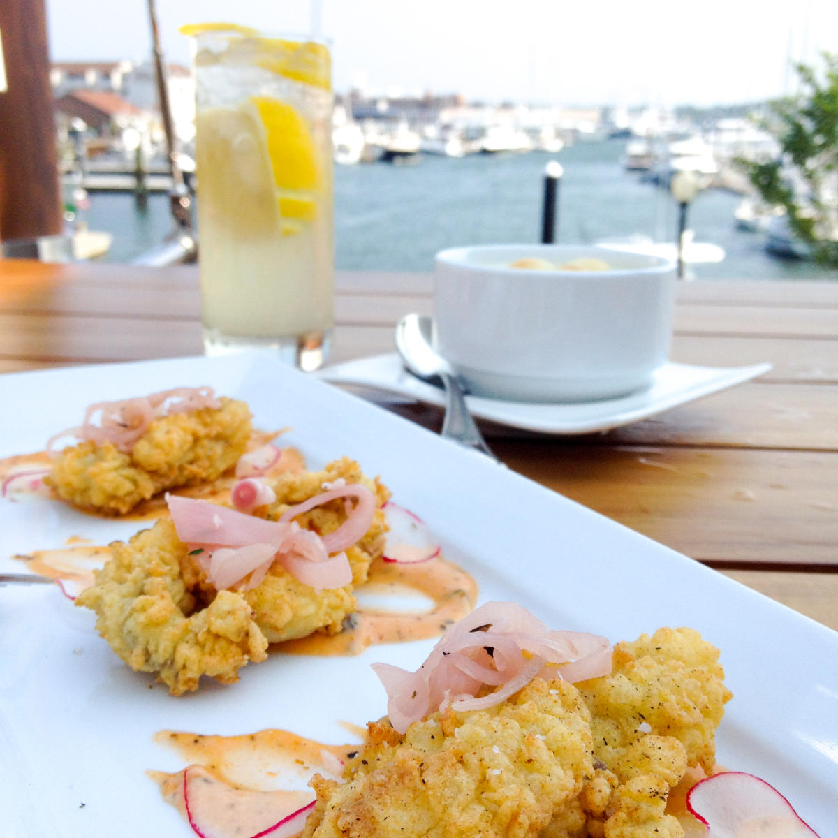 Fried seafood dish on a patio table at Skiff Bar in Newport RI