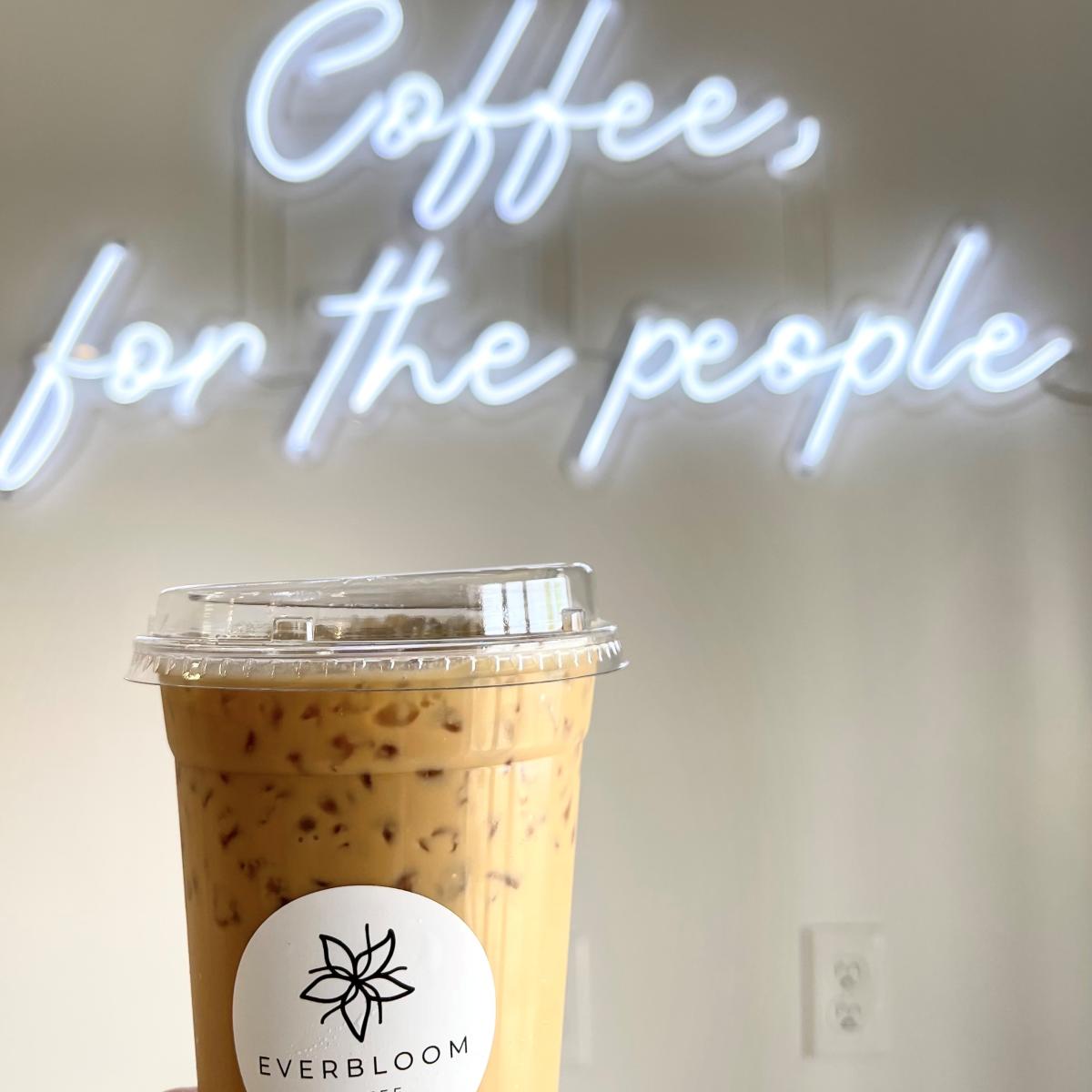 Everbloom Coffee with 'Coffee for the people' sign