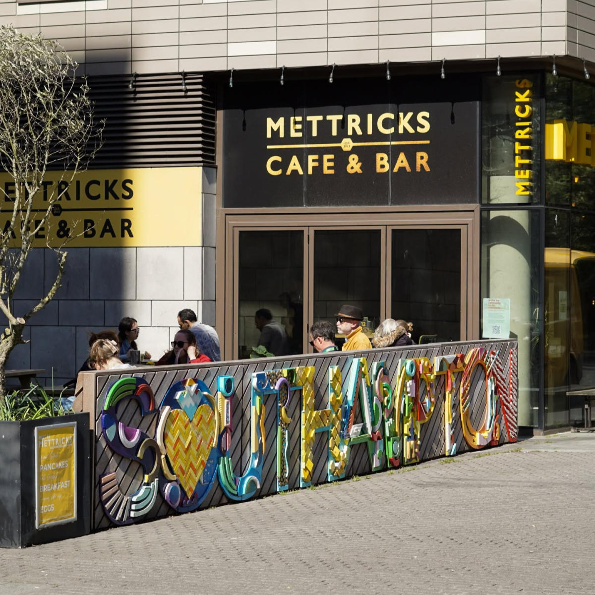 Mettricks Guildhall Southampton wooden sign