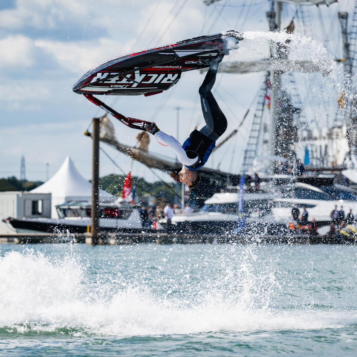 Man doing back flip on a jet ski at Southampton International Boat Show