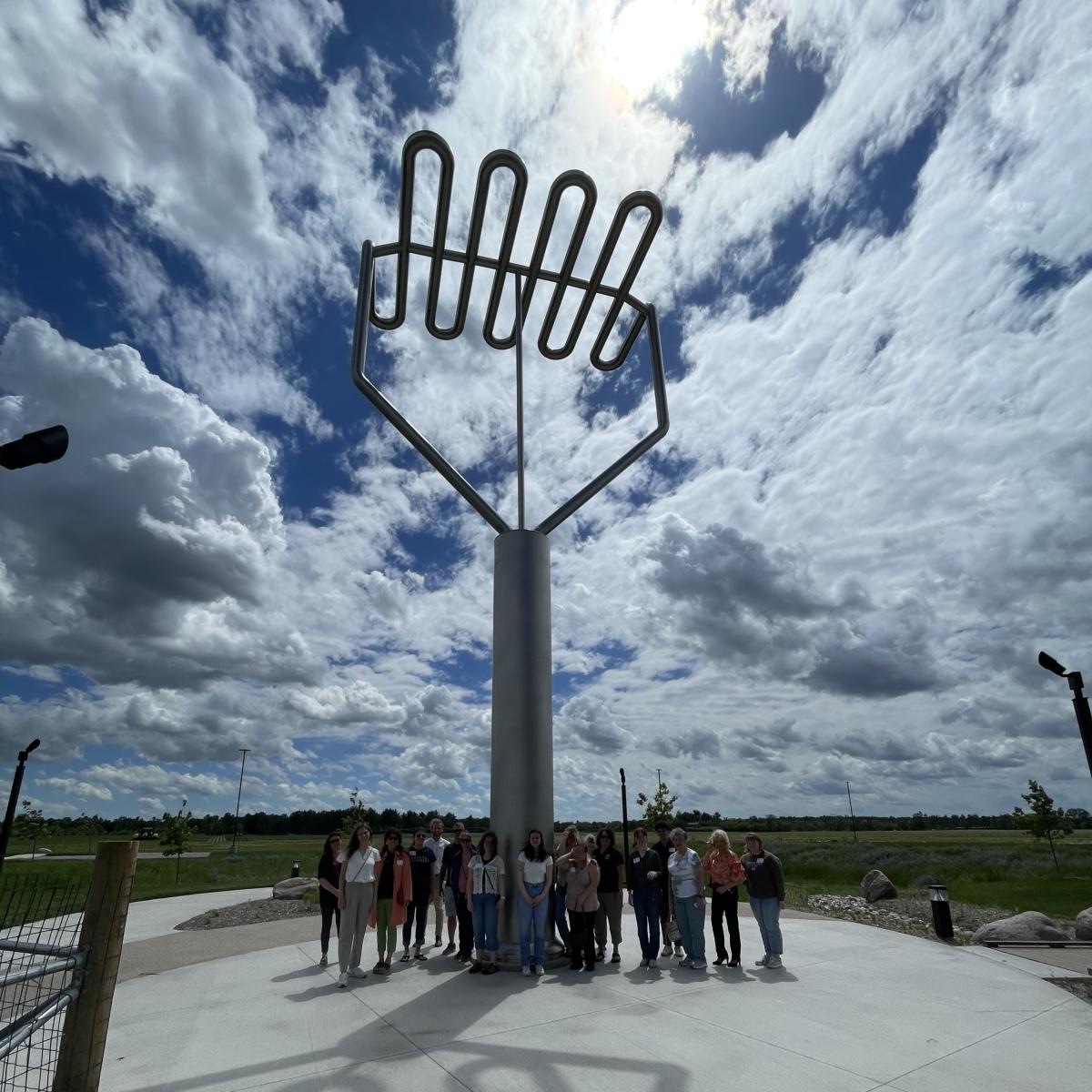 Visitors under the Worlds Largest Potato Masher