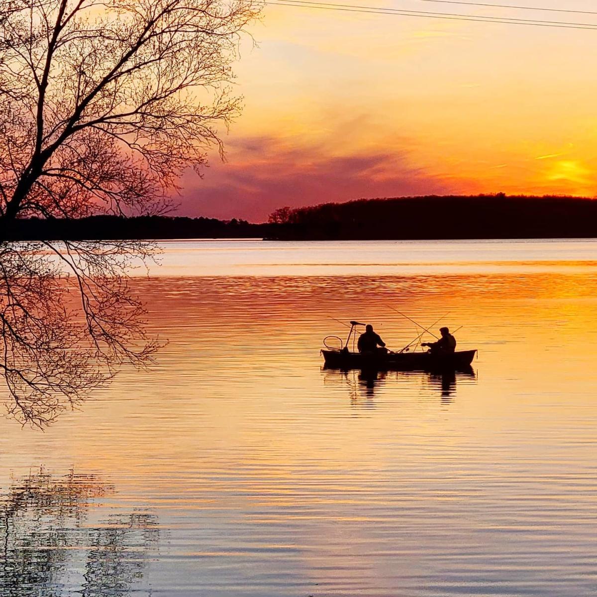 Fishing in a boat on the Wisconsin river at sunset