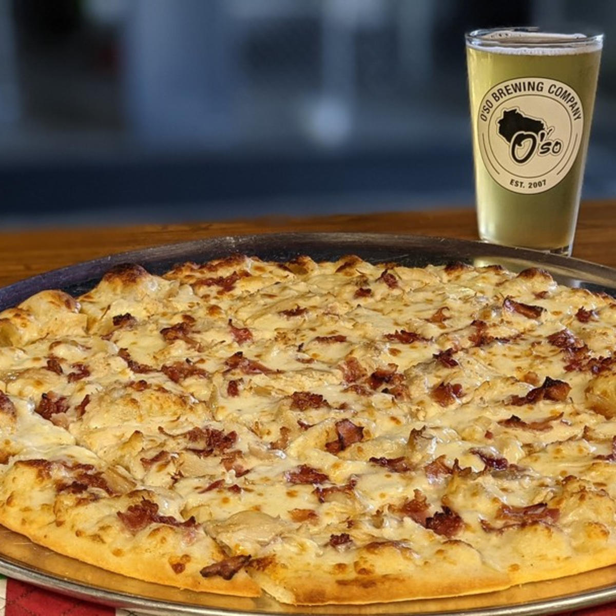 Snag a slice and grab a brew with a stop at O'so Brewing in the Stevens Point Area.