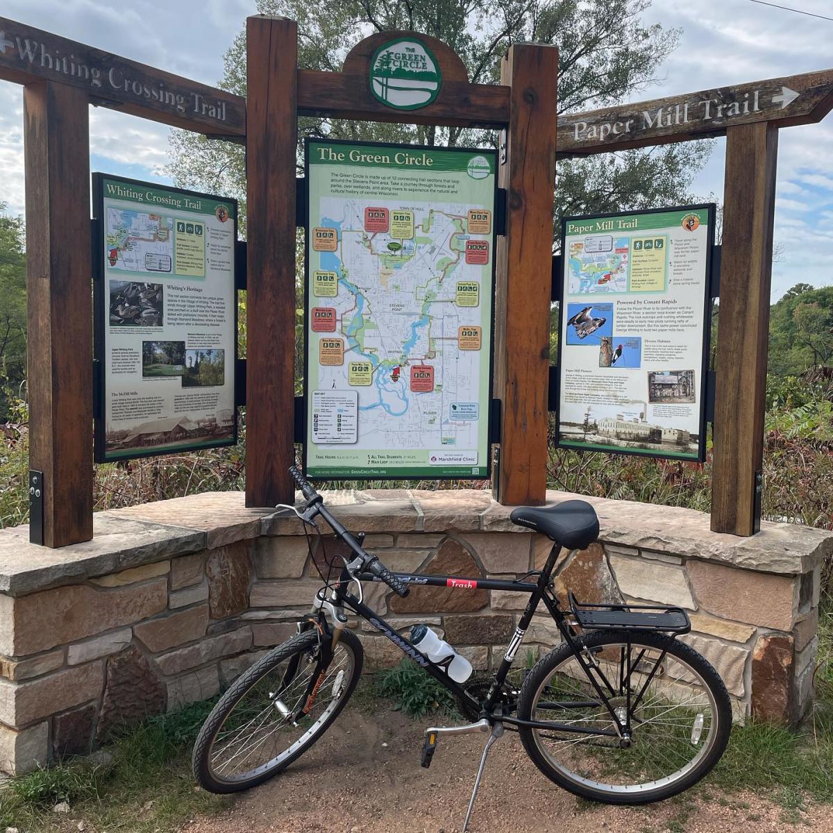 Bike in front of the Green Circle Trail Map