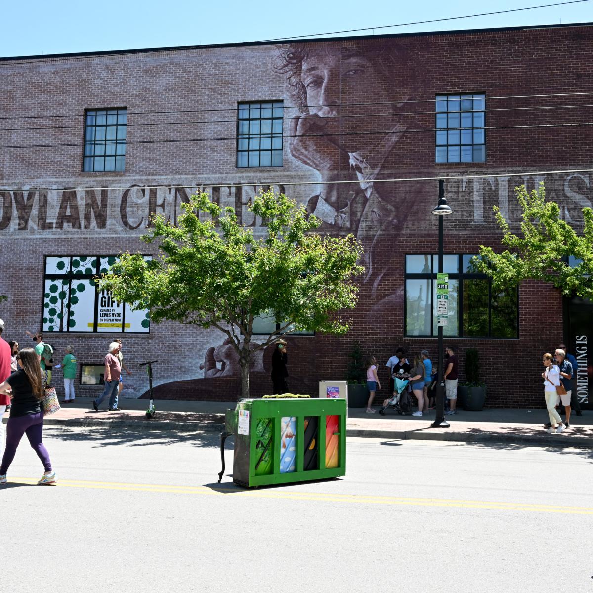 Bob Dylan Center exterior with people walking in front of it