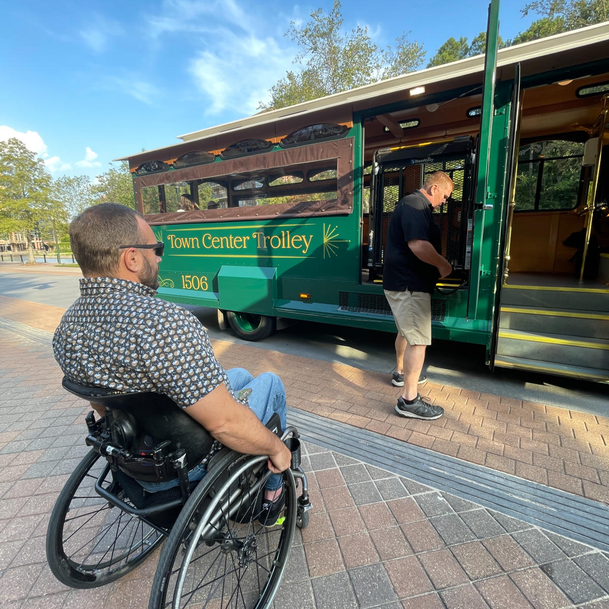 Man in wheelchair in front of Trolley