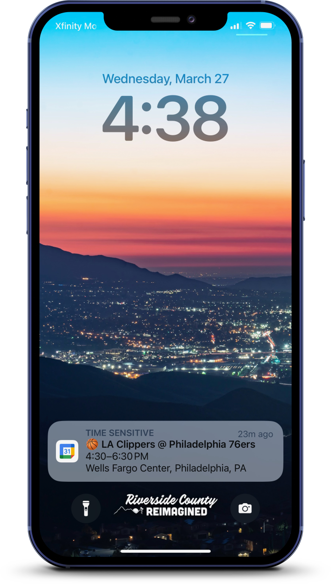 An iPhone mockup with a Riverside County Reimagined wallpaper on the lock screen.