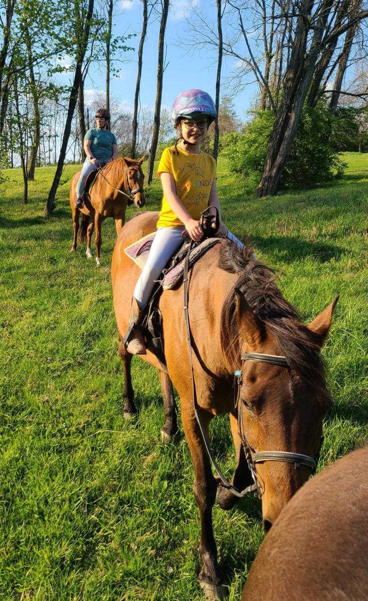 girl and woman riding horses at first farm in bed and breakfast in northern kentucky