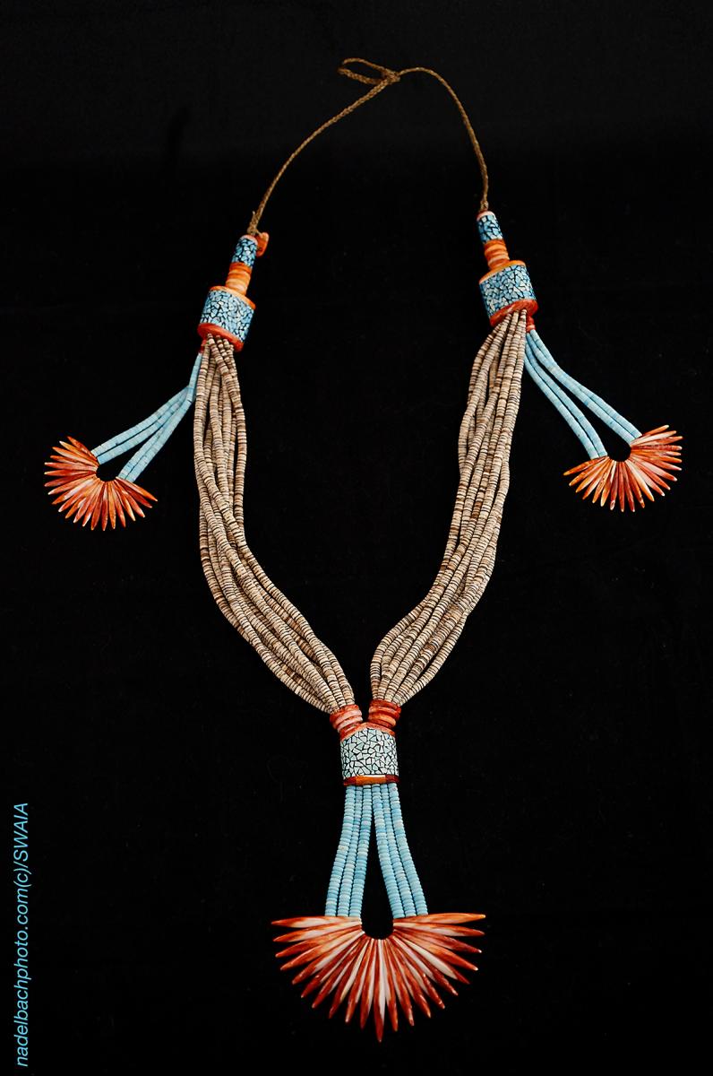 Farrell Pacheco worked on the necklace in their Kewa (Santo Domingo) Pueblo jewelry studio