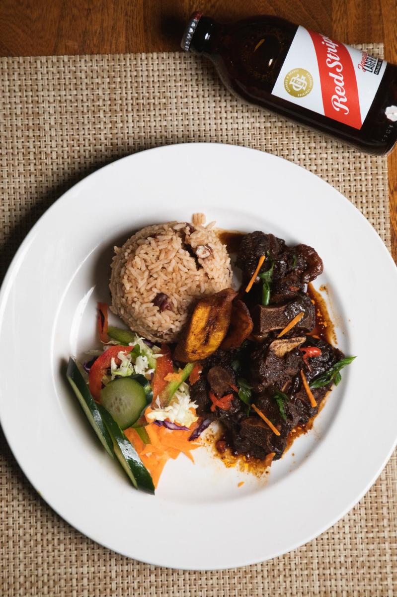 Plate Of Food And Rice From Donna's Caribbean In Fort Lauderdale